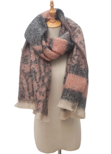 Detail of pink and grey leopard jacquard scarf with fringe on a mannequin