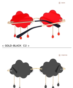 Detail of cloud shaped rimless sunglasses with gold chains and raindrop pendants