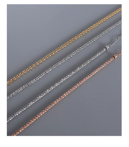 Detailed view of layered necklaces in gold, silver and rose gold finishes with extensions