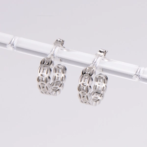 Vintage hollowed-out copper coin hoop earrings in polished silver for a stylish retro look