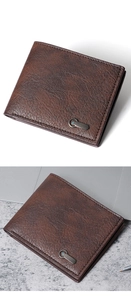 Close-up of dark brown business wallet with vintage leather texture and gunmetal clip