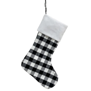 Large black and white plaid Christmas stocking with white plush cuff and hanging loop