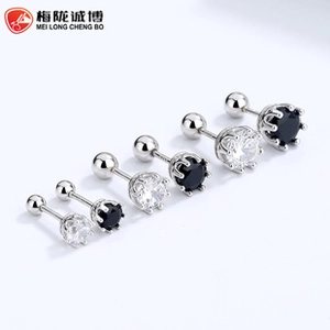 Macro detail of daisy flower earrings with screw back and black white cubic zirconia