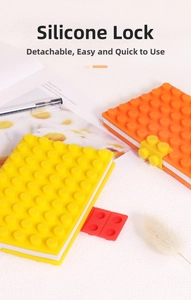 Close-up of silicone building block notebook with red locks and raised dot texture