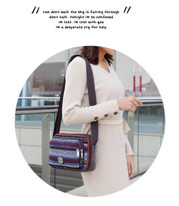 Ethnic style striped canvas shoulder bag with multi-zipper compartments and wide strap