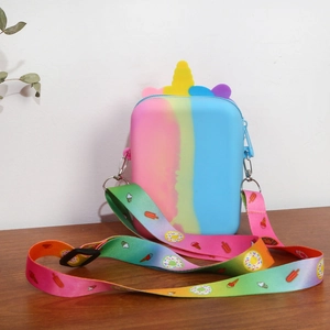 Close-up of rainbow unicorn silicone purse with adjustable dessert pattern shoulder strap