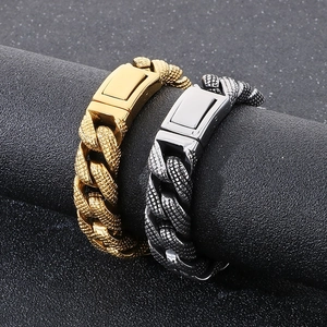Detailed macro of gold and silver cuban link bracelets with snake scale texture