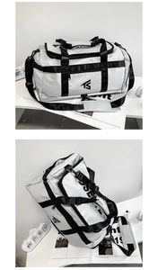 Detail of high-capacity oxford travel bag showing durable handles and adjustable shoulder strap