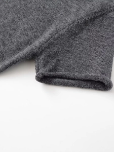 Detail shot of the ribbed knit cuff on a soft dark grey short-sleeve women dress