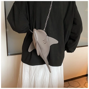 Detailed back view of a grey shark-shaped crossbody bag with a silver metal chain strap