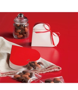 Detail view of heart-shaped gift boxes with ribbons for Valentine's candy and cookies