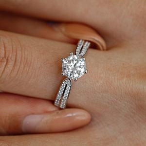Moissanite ring in S925 sterling silver with six-prong setting on a finger