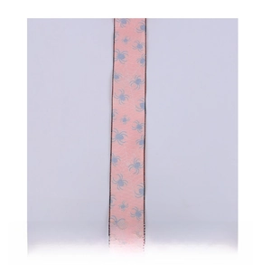 Detail of pink Halloween ribbon with blue spider prints and black stitched edges
