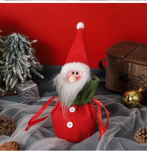 Close-up of Santa Claus knitted gift bag with drawstring and white beard texture