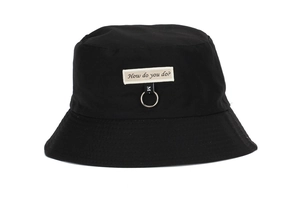Detail of black cotton bucket hat featuring embroidered logo and silver metal ring