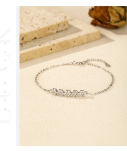 Detail of 925 sterling silver flower bracelet with sparkling pavé zircons and lobster clasp