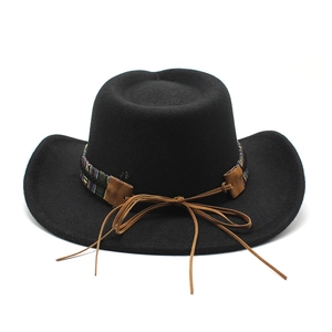 Classic black cowboy felt hat with ethnic woven band and wide curved brim for men and women