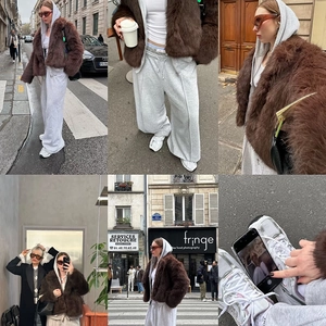 Short brown faux fur jacket paired with a grey hooded tracksuit on city streets