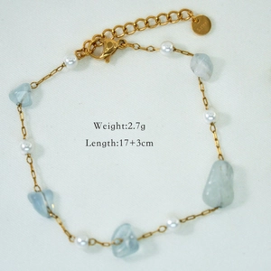Detail showing 2.7g stainless steel chain with blue natural stones and white pearls