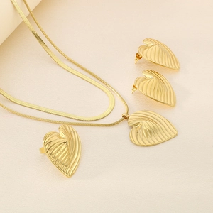 Close-up of textured leaf pattern on 18K gold plated stainless steel jewelry set