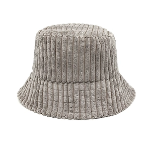 Close-up of light gray wide striped corduroy fabric texture on a stylish bucket hat