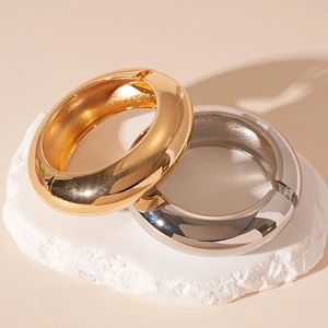 Minimalist wide geometric metal bangles in gold and silver finish on stone base