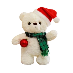 Orsetto di peluche bianco con cappello di Natale e sciarpa con pallina rossa