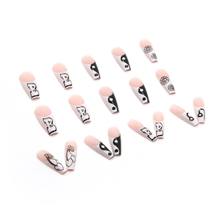 Y2K style long French press-on nails with black white patterns and flower designs