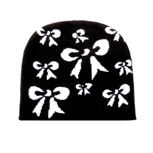 Berretto in maglia nera da donna con motivo a fiocco bianco caldo per l'autunno inverno
