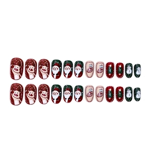 Christmas press-on nails set featuring Santa Claus, reindeer, and snowman holiday designs