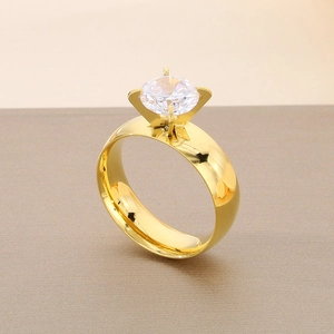 Macro view of a 6mm gold stainless steel ring featuring a large round cubic zirconia