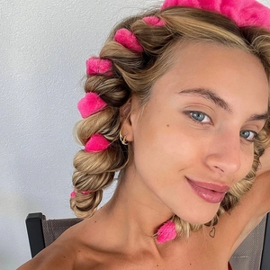 Pink velvet heatless hair curler wrap shown on model for natural wavy hairstyles