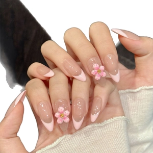 Handmade press-on nails with 3D floral accents and French almond pink design
