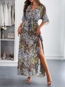Detail of high-slit waist tie dress with leopard and purple floral patterns