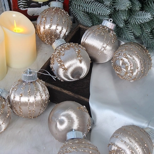 Set of 8 champagne silk Christmas ball ornaments with gold glitter on white fur