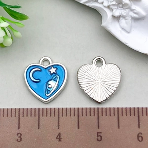 Detailed view of heart-shaped enamel pendants showing front pattern and size measurement