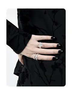 Detail of S925 sterling silver ring set with zircon pavé and irregular wave texture