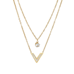 Detail of double-layer gold titanium steel necklace with V-shaped pendant and zircon