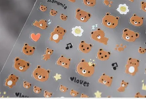 Macro detail of 5D embossed cartoon bear nail art stickers with matte texture and hearts