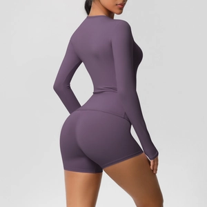 Macro shot of dark purple brushed yoga set showing side fit and body sculpting fabric