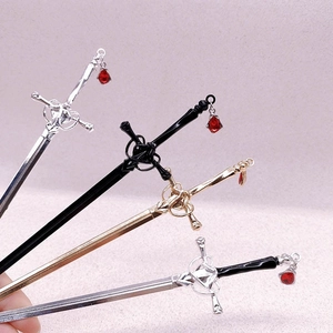 Sword hairpins with red crystal teardrops in silver, black, and gold finishes