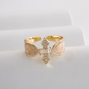 18K gold plated copper ring with beige enamel star design and sparkling zircon stones
