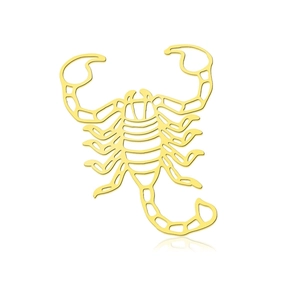 Macro view of a gold scorpion pendant with detailed cut-outs and polished steel finish