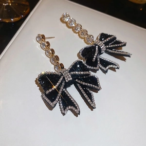 Elegant silver needles bow earrings with black velvet and sparkling zircon tassels