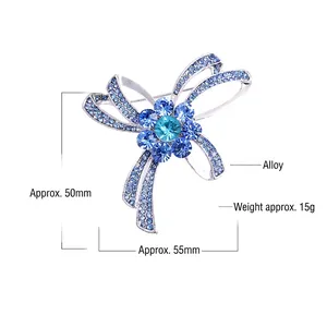 Detail view of silver alloy butterfly flower brooch with blue rhinestones, size 50x55mm