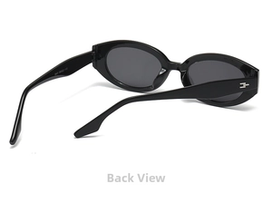 Detail view of black cat-eye sunglasses with metal hinge accents and printed inner temple size