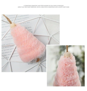 Close-up of pink faux fur Christmas tree ornament with wooden bead and jute rope hanger