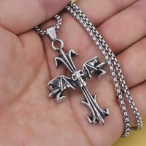 Vintage stainless steel skull cross necklace with bat wings on a box chain