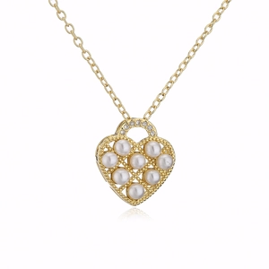 Detail of 18K gold plated heart pendant necklace with pearls and zircon stones