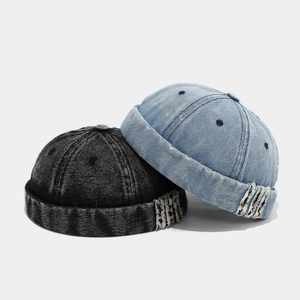 Black and light blue washed denim docker caps with vintage distressed edge details